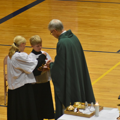 Student take part in weekly mass.